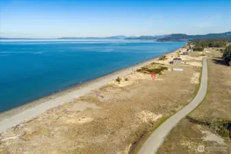 This is the shared road that winds through the entire Surfcrest community. Property is noted with Red marker.