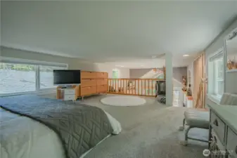 The generous 11x15 loft serves as a cozy and private master bedroom retreat