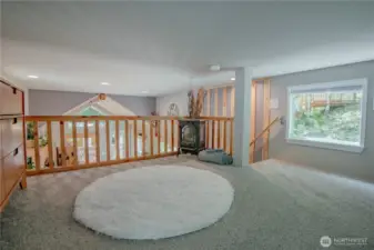 The loft features a full railing and offers fantastic views overlooking the interior of the home.
