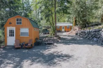 The driveway extends alongside the impressive, well-constructed rock wall