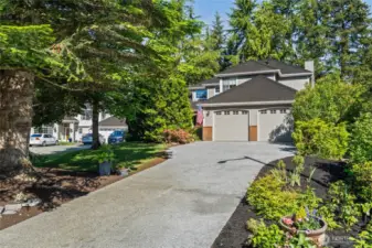 This welcoming brand new driveway invites you to enter.