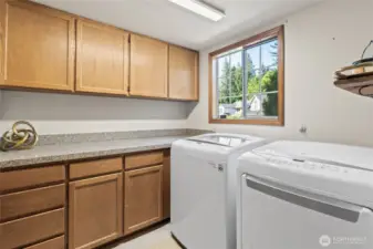 Newer washer & dryer. Lots of storage in laundry room.