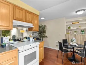 Galley-style, yet very open eat-in kitchen opens-up to living room.