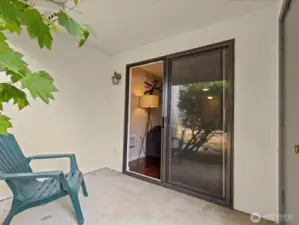 Good-sized covered back patio with closet storage