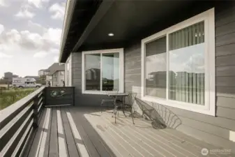 Imagine yourself sitting on this expansive deck, enjoying your coffee and watching the ships go by!