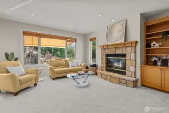 Spacious family room with fireplace and built-ins, offering a warm and inviting gathering space