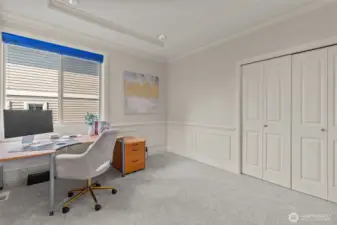 Dedicated home office or flex space with built-in storage and plenty of natural light.