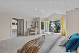 Generous primary bedroom retreat with vaulted ceilings, sitting area, and peaceful backyard outlooks.