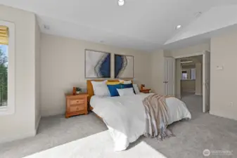 Secondary bedroom with large windows and flexible layout for guests or home office use.