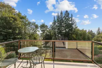 Private balcony offering tranquil treetop views and a peaceful place to unwind.