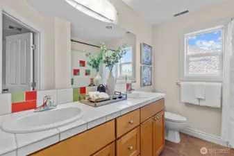 Double-vanity bathroom with ample storage and clean, timeless finishes.