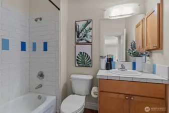 Full bathroom with modern tile surround and clean, classic finishes.