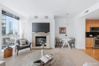 Dining Space: A cozy dinner nook is situated next to the kitchen, providing an intimate setting, or guests can enjoy the living room space adjacent to the fireplace.