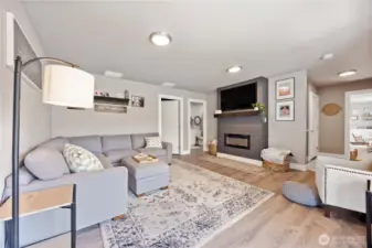 View of daylight basement family room with fire place