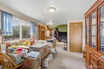 Dining Room facing Entry and Living Room (Family is packing, excuse the mess!) Coat closet shown.