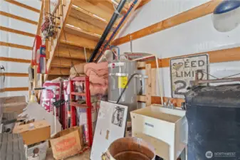 Under the Stairs: Hot Water Tank and Laundry Sink for Quick Clean Ups!