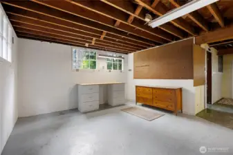 Room to the right, original boys bathroom has plumbing and second water heater.