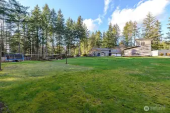 Large backyard with volleyball court, trampoline, horseshoe court, wood burning fire pit and stadium lighting!  Additionally, DADU with deck off the side