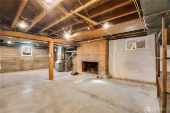 The 2nd fireplace is a fun surprise, and the 2023 gas furnace is just a few feet beyond.