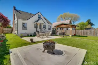 Head out to the fully fenced yard with its sunny patio and hot tub pad both poured in 2023. Get some shade on the paver patio under the gazebo cover.