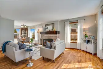 Now that you've seen a few highlights, we'll start right here at the front door. A south window catches the sunlight to brighten the living room.