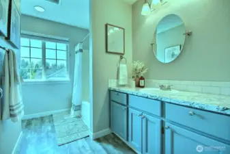 Upper level main bath with tub/shower and lots of counter space.
