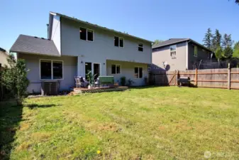 Fully fenced backyard with a deck – ideal for summer BBQs and outdoor fun.