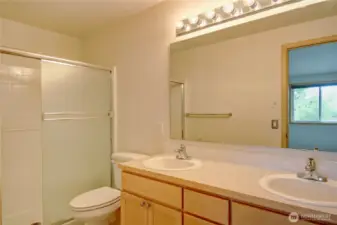Primary Bathroom with double sinks walk in shower