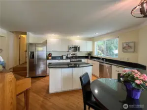 Updated kitchen with newer cabinets, granite counters and appliances. Also, a nice eat in kitchen with area.