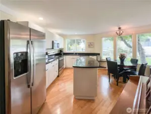 Updated kitchen with newer cabinets, granite counters and appliances. Also, a nice eat in kitchen with area.