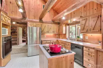 Beautiful custom pine cabinetry and handy center island.