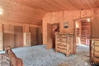 Primary bedroom looking towards bathroom. Convenient 2nd laundry in closet behind door.