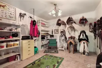 Insulated and heated tack room with lots of storage.