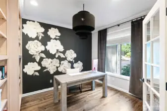 Mainfloor office with built-ins and extended hardwood floors