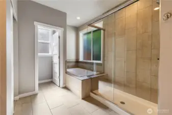 Large walk in shower and deep tub.