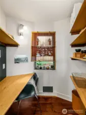 A tucked-away alcove adapts with ease—functioning as a pantry, home office, or powder room depending on need. Flexible spaces like this underscore the home’s thoughtful design, where every corner connects to Olmsted’s parkland living.