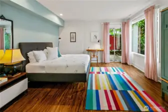 A generous lower-level suite opens directly to the garden patio, blending indoor comfort with outdoor living. With room for both rest and work, it offers guests or family members a private retreat within Olmsted’s woodland enclave.