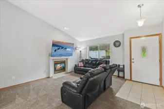 Enter the home into your comfy, specious living room featuring a warm, propane fireplace