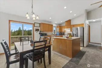 Convenient dining area open to kitchen, living room and deck. Hallway on right leads to bedrooms #1, #2 and hall bathroom. All current living area is on the main level. Ideal for people who don't like stairs