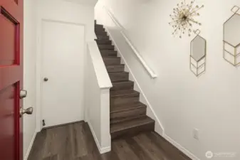 Inviting entry foyer can be accessed from the front door or garage. New low maintenance laminate flooring throughout!