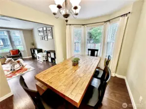 Large dining room with bay window, perfect for gathering a crowd