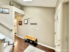 Another view of entry, powder room and closet just down the hallway.