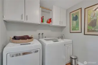 Laundry Room with washer/dryer that stay.  Note laundry sink!  There is a door to outside from here, making it an easy mudroom too! Door from here direct to dog run.  Makes poochie clean-up easy!