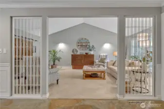 Formal living with vaulted ceilings and Plantation Shutters.