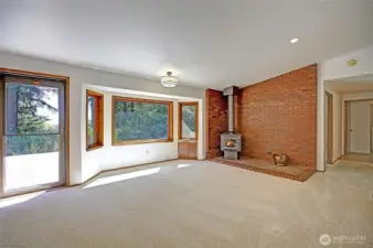 A door with screen leads out onto the large back deck.