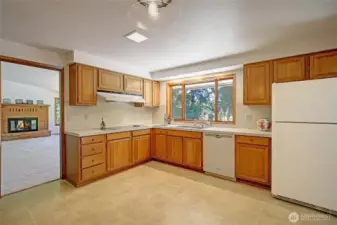 Central to the heart of the home is the abundant sized kitchen with dual accessibility doors
