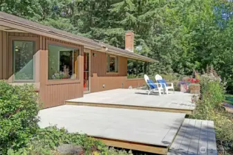 Step outside and into a true sanctuary.  This thoughtfully designed multi-level deck isn't just an extension of the home, it's a seamless bridge to the living, breathing landscape that surrounds it.
