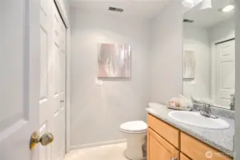 Hall bath with side by side washer and dryer