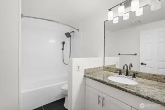 Newly installed shower head, light fixture and bluetooth music fan