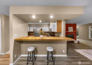 Saddle up to the kitchen bar for additional seating